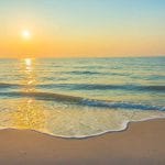 ubezpieczenie na wakacje w Grecji zachód słońca plaża