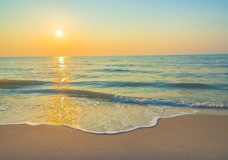 ubezpieczenie na wakacje w Grecji zachód słońca plaża